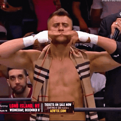 Shirtless Wrestler With Scarf And Tickets On Sale Now Sign GIF