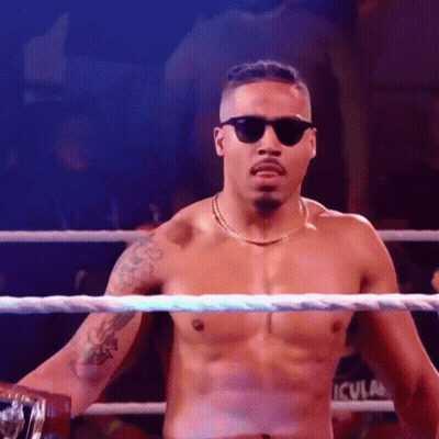 Shirtless Wrestler With Sunglasses And Chain In Ring GIF