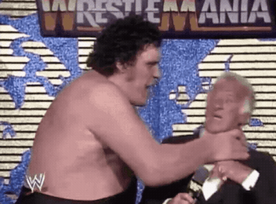 Shirtless Wrestler Wrestling Another In Front Of World Map GIF