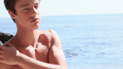 Shirtless Young Man On Beach GIF