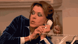 Shocked Woman Making Phone Call