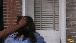 Shocked Woman Pull Hair In Front Door GIF