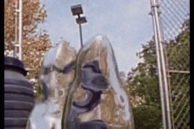 Shoes Hanging On Chain Link Fence Tennis Court GIF