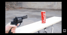 Shooting Coke With Gun GIF