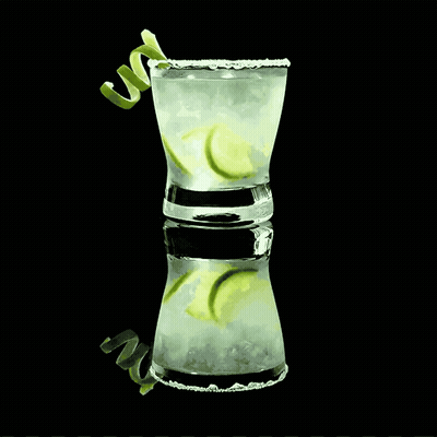 Shot Glass Drink With Ice And Limes GIF