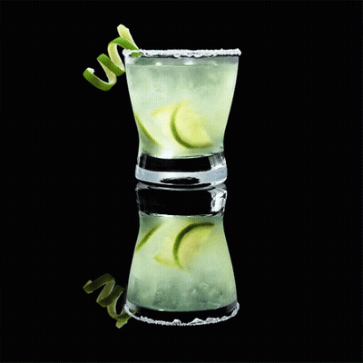 Shot Glass With Ice And Limes GIF