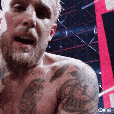 Showtime Text On Man's Shoulder GIF