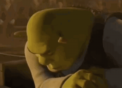 Shrek From Shrek Is Making A Funny Face While Looking At Something . GIF
