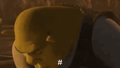 Shrek From Shrek Is Smiling And Looking At The Camera With A # On His Face . GIF
