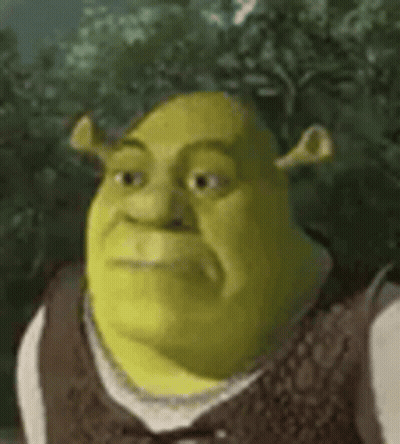 Shrek From Shrek Is Wearing A Brown Vest And Bow Tie And Looking At The Camera . GIF