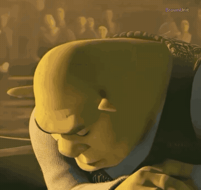 Shrek From The Animated Movie Shrek Is Looking Down With His Eyes Closed GIF