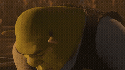 Shrek From The Movie Shrek Is Looking At The Camera With A Serious Look On His Face GIF