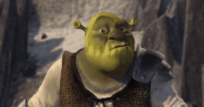 Shrek From The Movie Shrek Is Looking At The Camera With A Serious Look On His Face GIF
