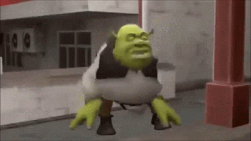 Shrek From The Movie Shrek Is Standing On His Hind Legs On The Sidewalk . GIF