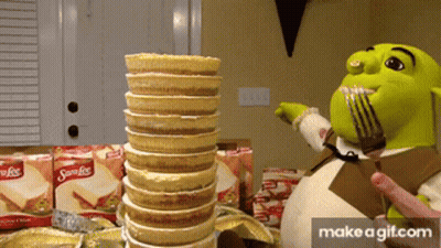 Shrek Holding Fork Next To Samoas Cookies GIF