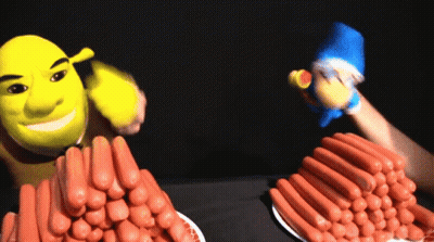 Shrek Is Standing Next To A Pile Of Hotdogs GIF