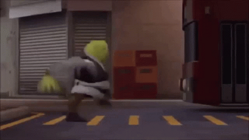 Shrek Is Walking Across A Crosswalk In Front Of A Bus . GIF