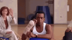 Shy Man Slowly Raising Hand GIF