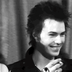 Sid Vicious Punk Smile Smoking GIF