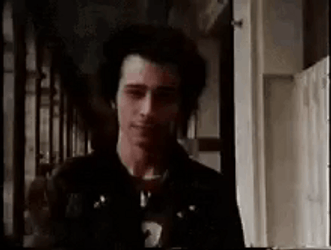 Sid Vicious Showing Knife GIF