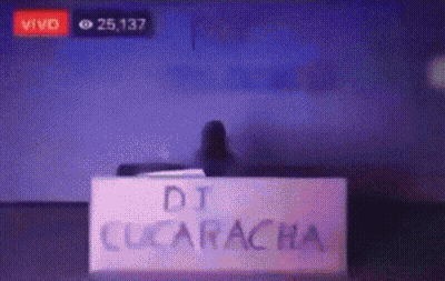 Sign Saying DJ Cucaracha In Front Of Screen GIF