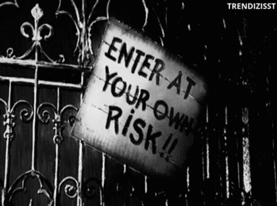 Sign Saying Enter At Your Own Risk GIF