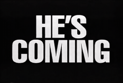 Sign Saying He's Coming GIF