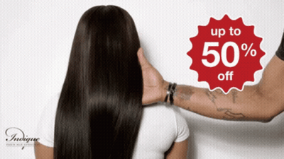 Sign Saying Up To 50% Off Above Woman's Hair GIF
