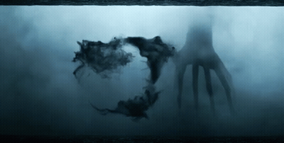 Silhouette Hand Coming Out Of Water In Dark Room GIF