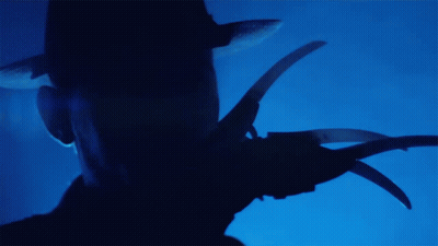 Silhouette Holding Scissors GIF
