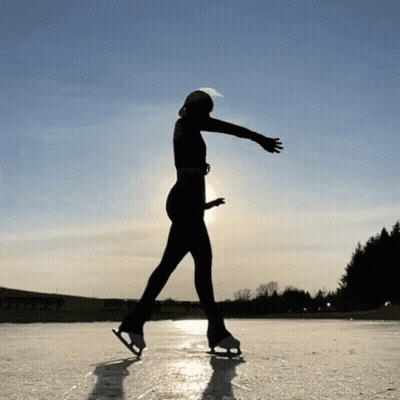 Silhouette Ice Skating On Sunny Day GIF