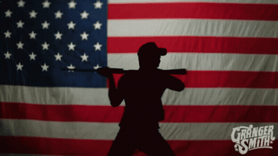 Silhouette Man Holding Gun In Front Of American Flag Granger Smith GIF
