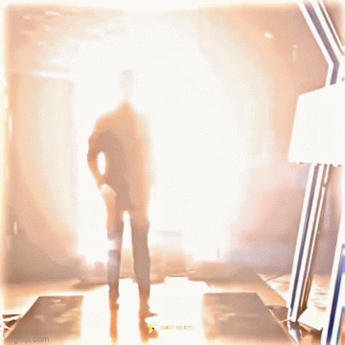 Silhouette Man In Suit Walking Through Tunnel GIF