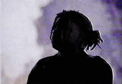 Silhouette Man With Dreadlocks In Dark Room GIF
