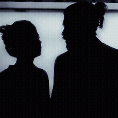 Silhouette of Man and Woman Kissing