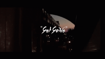 Silhouette Of Man In Dark Room With Neon Lights GIF