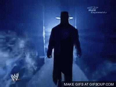 Silhouette Of Man In Hat Walking Down Hallway GIF