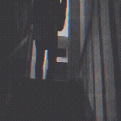 Silhouette Of Man Playing Guitar In Dark Room GIF