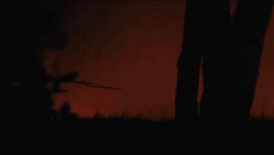 Silhouette Of Man Running With Sword GIF