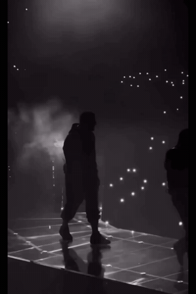 Silhouette Of Man Walking On Stage GIF
