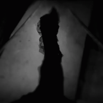 Silhouette Of Person With Glowing Eyes GIF