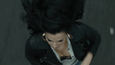 Silhouette Of Woman In Circle With Arms Outstretched GIF