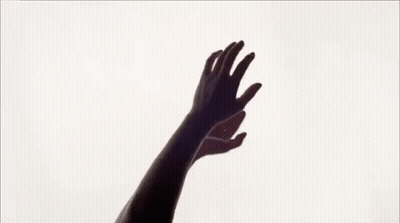 Silhouette Of Woman With Hands In Air GIF