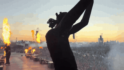 Silhouette Person Arms Outstretched Flames GIF