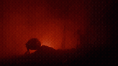Silhouette Person In Dark Room With Red Light GIF