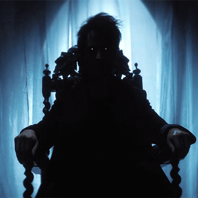 Silhouette Person Sitting In Chair By Window GIF