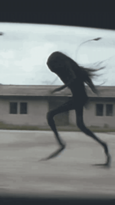 Silhouette Running Down Street GIF