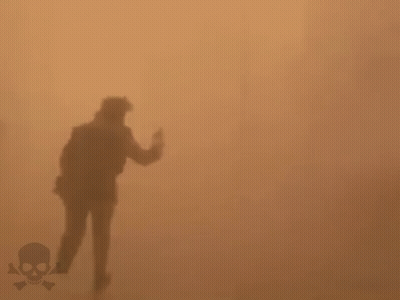 Silhouette Running In Foggy Field With Skull And Crossbones GIF