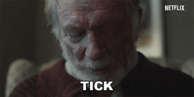 Silhouette Sitting In Chair Behind Glass Wall GIF