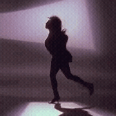 Silhouette Woman Dancing In Dark Room GIF